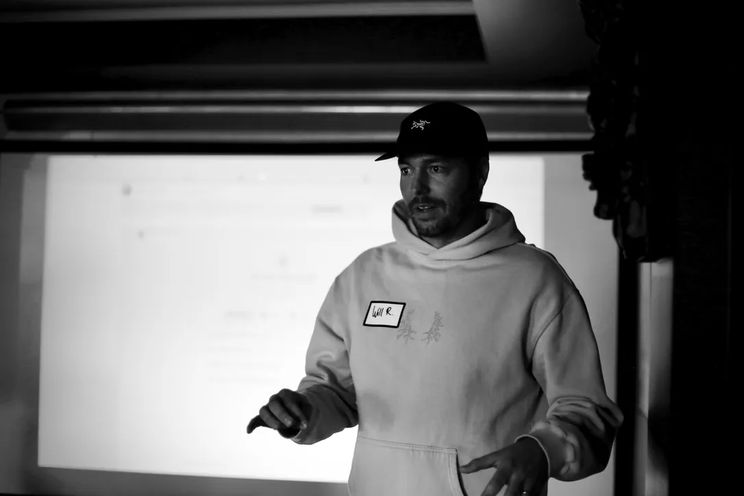 Will Rowston speaking on stage at a Cursor meetup